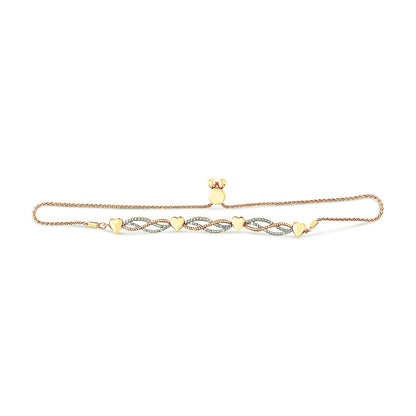 Yellow metal bracelet with connected heart shapes and intertwined sections set with white gemstones, viewed from above on a white background.