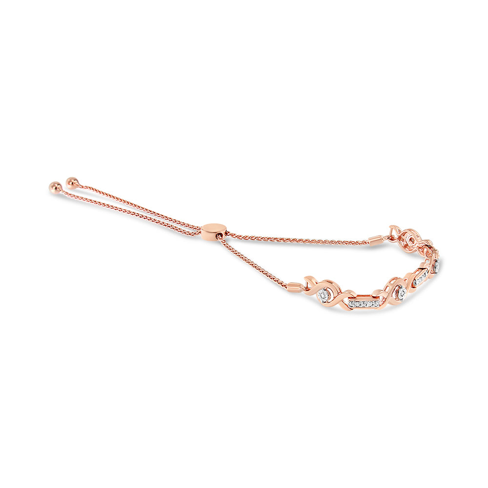 Rose metal bracelet with round white gemstones in miracle and prong settings, adjustable chain, shown from a slight side angle.