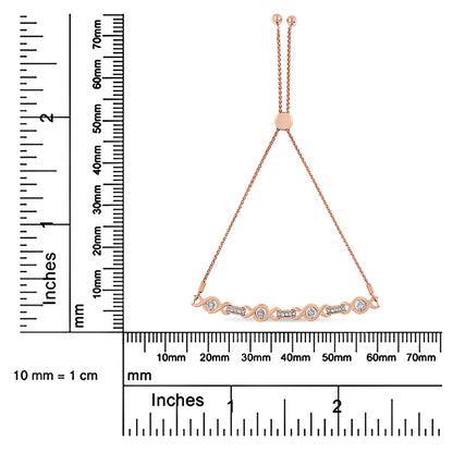 Rose metal bracelet with a mix of round white gemstones in miracle and prong settings, displayed flat on a ruler for size reference.
