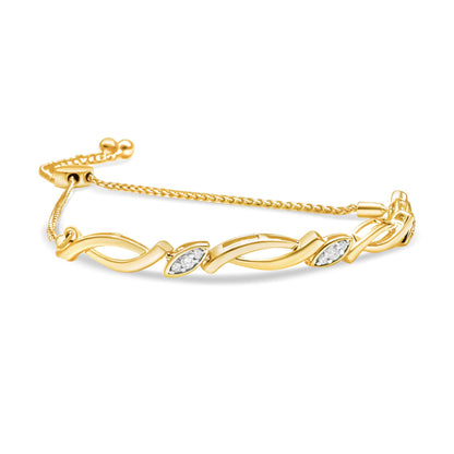 Yellow bracelet with twisted design and two marquise-shaped sections with white gemstones in pave setting, shown in a side angle.