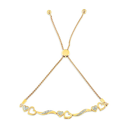 Yellow metal bracelet with alternating solid and open heart shapes set with small white gemstones, shown flat from a top-down angle.