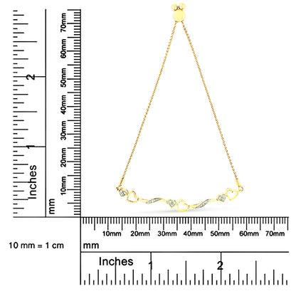Yellow bracelet with alternating heart shapes and curved links set with small white round pave gemstones, shown flat against two rulers for size reference.