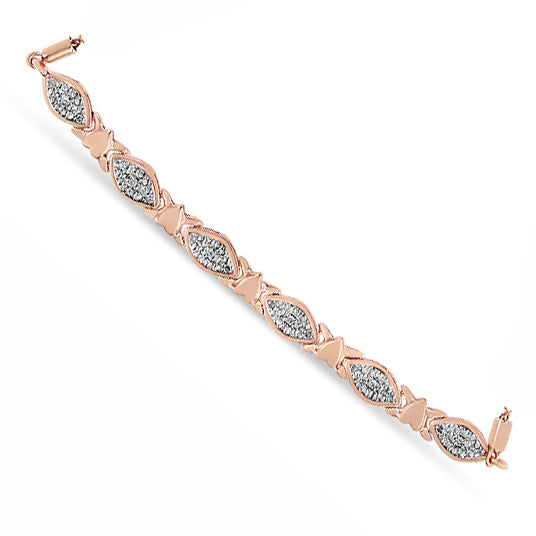 Rose-colored bracelet shown from above featuring alternating marquise-shaped sections set with white round gemstones in pave setting and solid bow-shaped links.