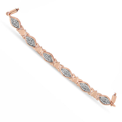 Rose-colored bracelet shown from above featuring alternating marquise-shaped sections set with white round gemstones in pave setting and solid bow-shaped links.