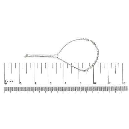 White metal bracelet with round white gemstones in pave setting, shown in a top-down view on a ruler for size reference.