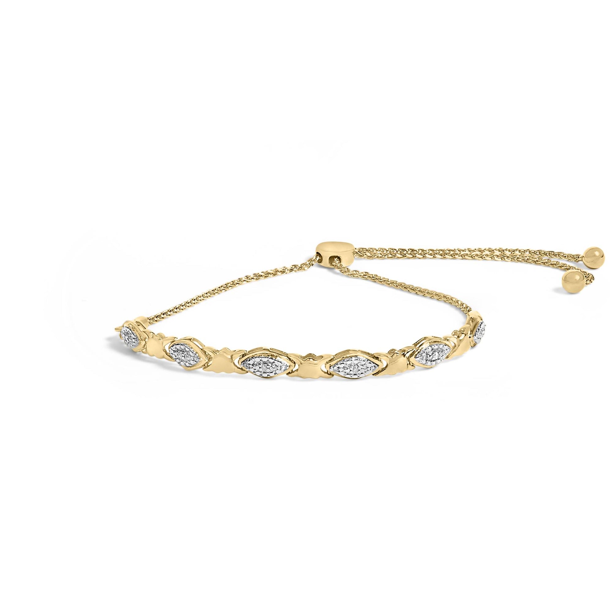 Yellow bracelet with alternating marquise-shaped links set with white gemstones in pave style, shown from a slight side angle.
