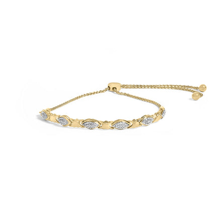 Yellow bracelet with alternating marquise-shaped links set with white gemstones in pave style, shown from a slight side angle.