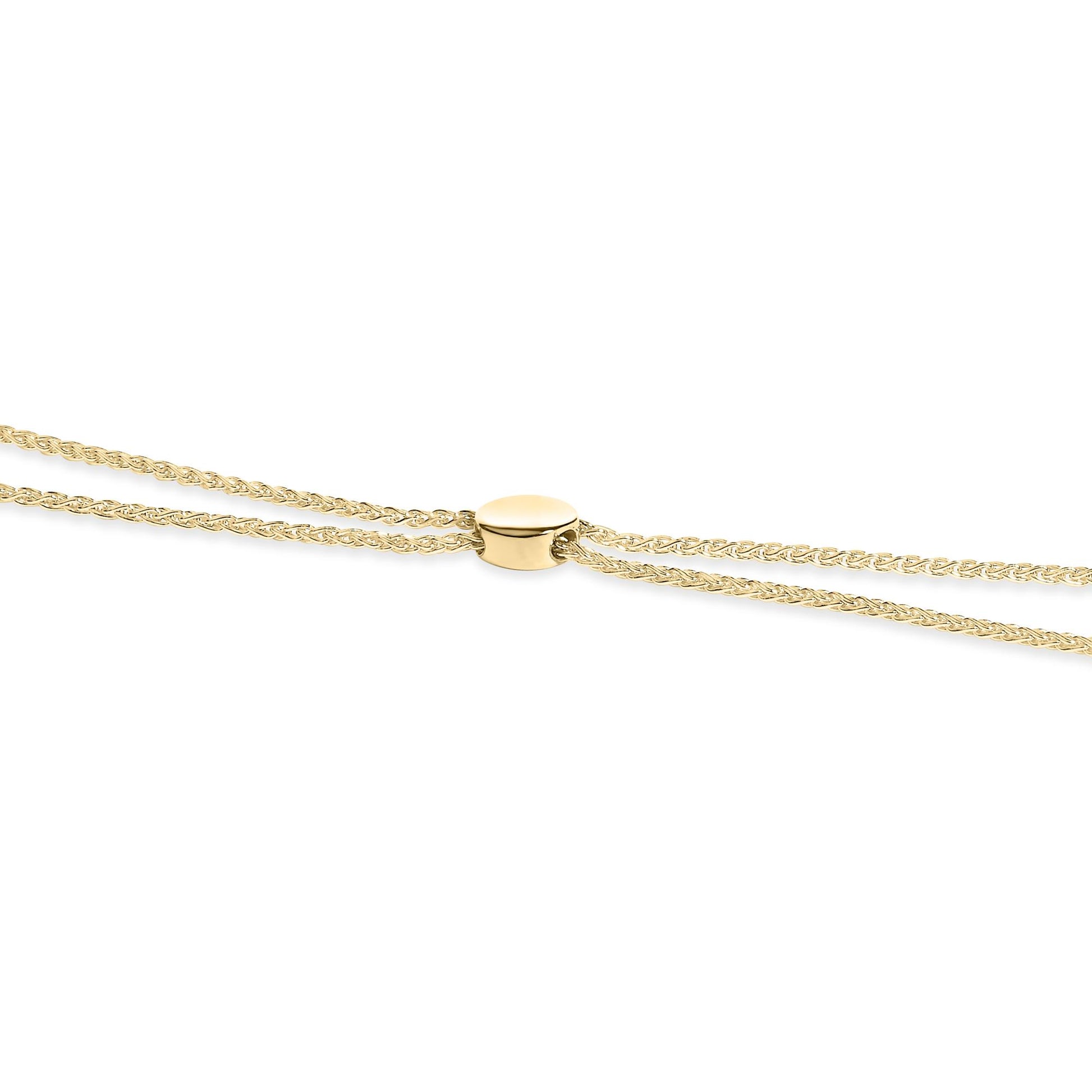 Close-up front angle of a yellow metal bracelet with an oval clasp featuring multiple round white gemstones in a pave setting.