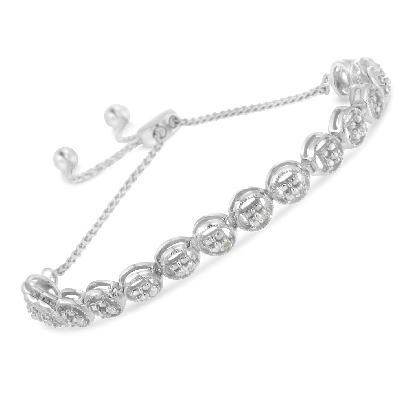 White metal bracelet with round white gemstones in prong settings, shown at an angle.