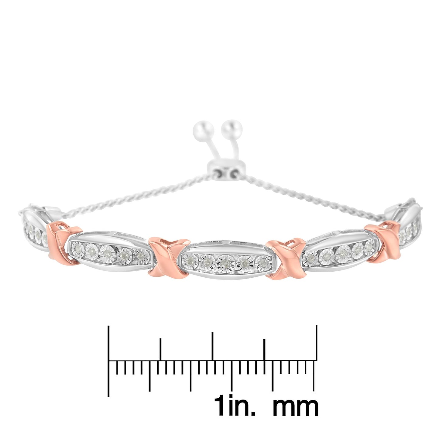 Front view of a white and rose metal bracelet with oval links set with round white gemstones in miracle setting, displayed on a ruler for size reference.