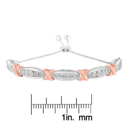 Front view of a white and rose metal bracelet with oval links set with round white gemstones in miracle setting, displayed on a ruler for size reference.