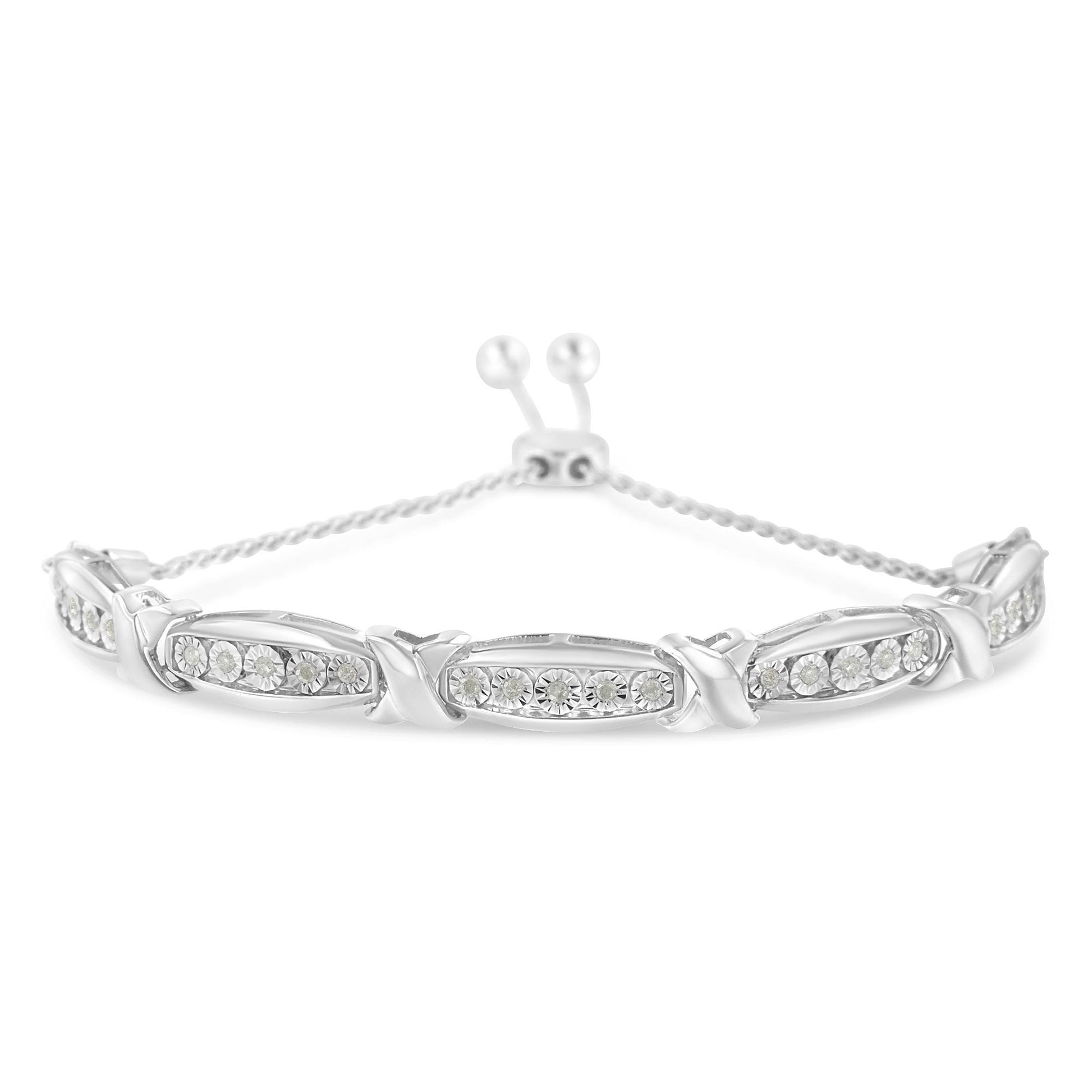 White metal bracelet with linked oval sections each set with round white gemstones in miracle setting, viewed from a front angle.