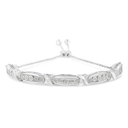White metal bracelet with linked oval sections each set with round white gemstones in miracle setting, viewed from a front angle.