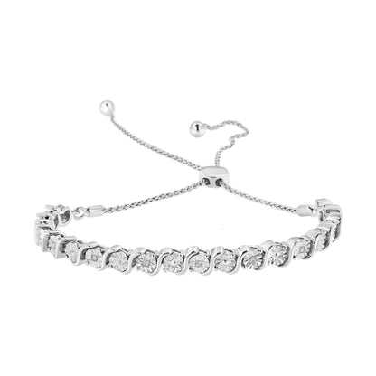 White metal bracelet with round white gemstones in a miracle setting, shown at a slight angle on a white background.