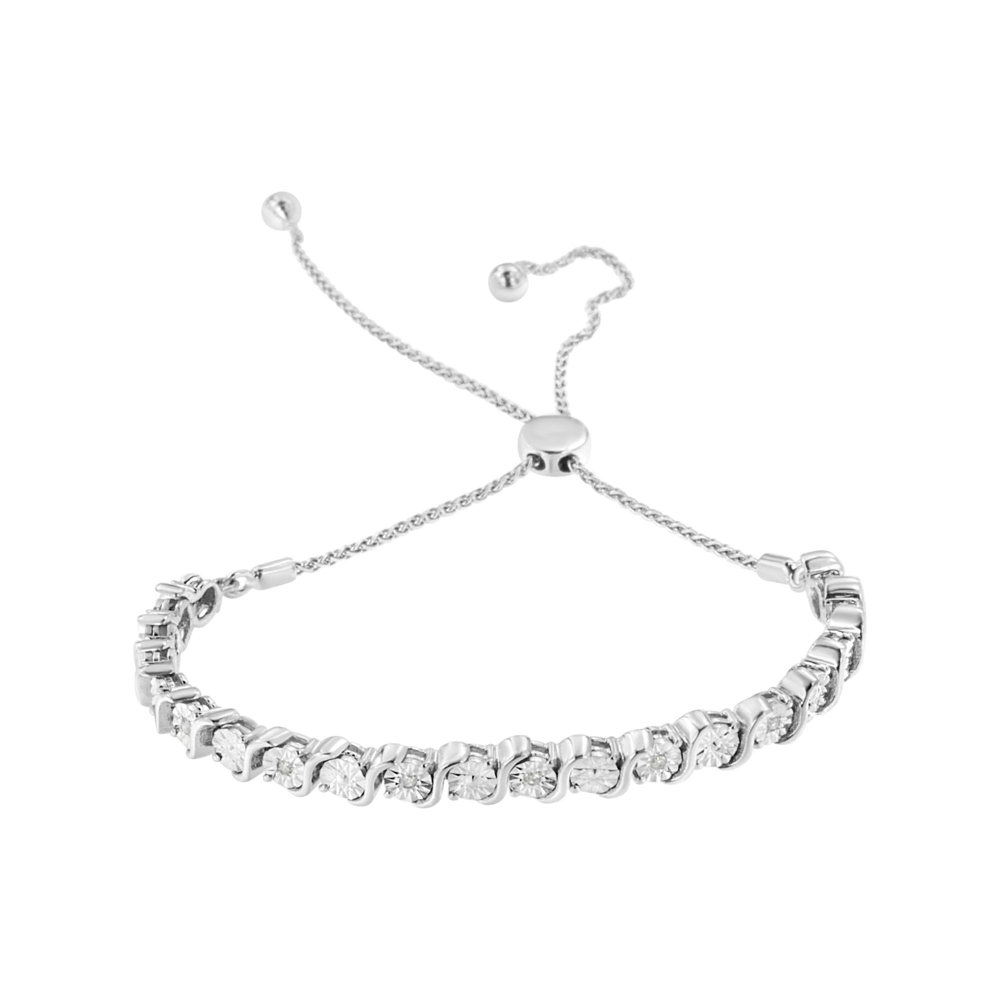 White metal bracelet with round white gemstones in a miracle setting, shown from an angled top view with adjustable chain ends.