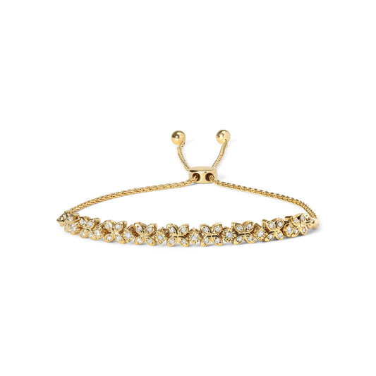 Yellow metal bracelet with flower-shaped links featuring white round gemstones in prong and miracle settings, shown from a front angle on a white background.