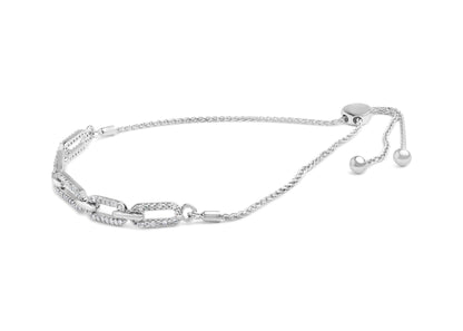 White metal bracelet with interlocking rectangular links partially set with white round gemstones, shown from a side angle.
