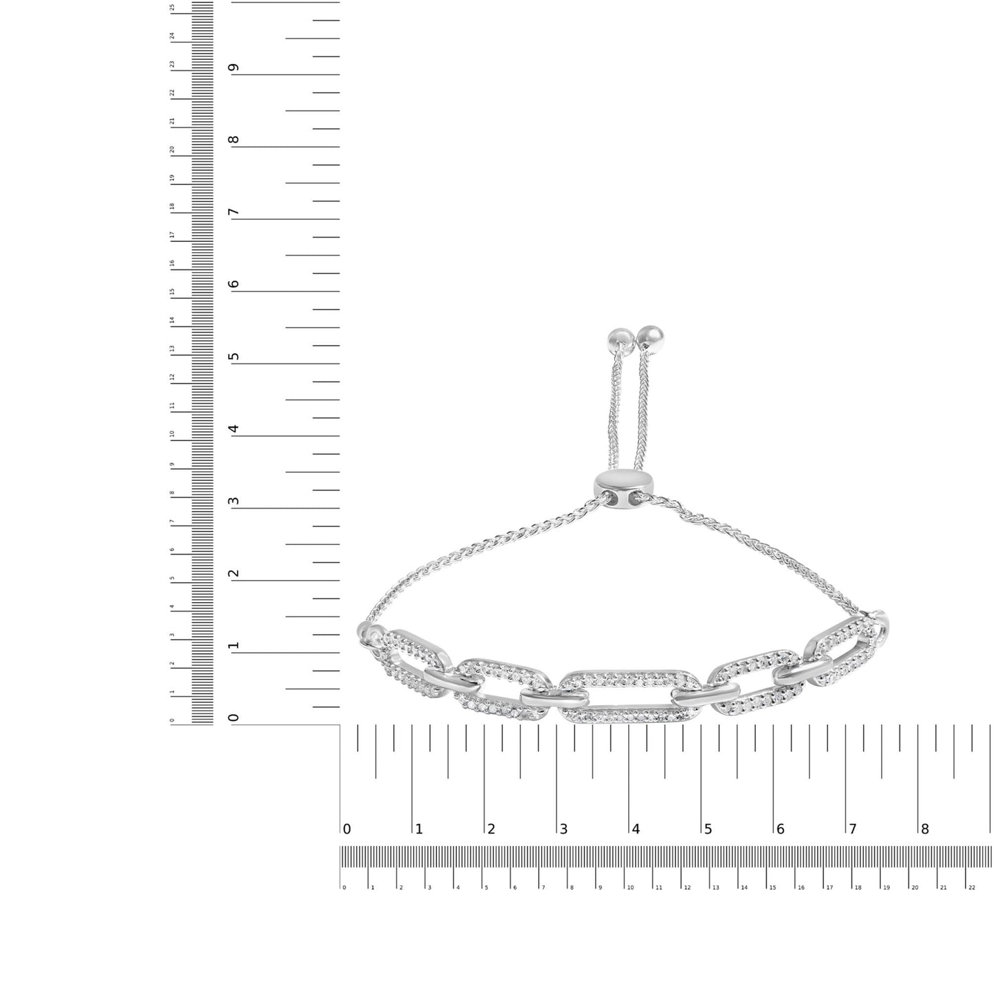 White metal bracelet with alternating plain and white gemstone-encrusted links, shown flat on a ruler for size reference, photographed from the top.