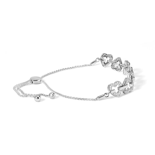 White metal bracelet with heart-shaped links accented with white round gemstones, shown from a slightly elevated side angle.