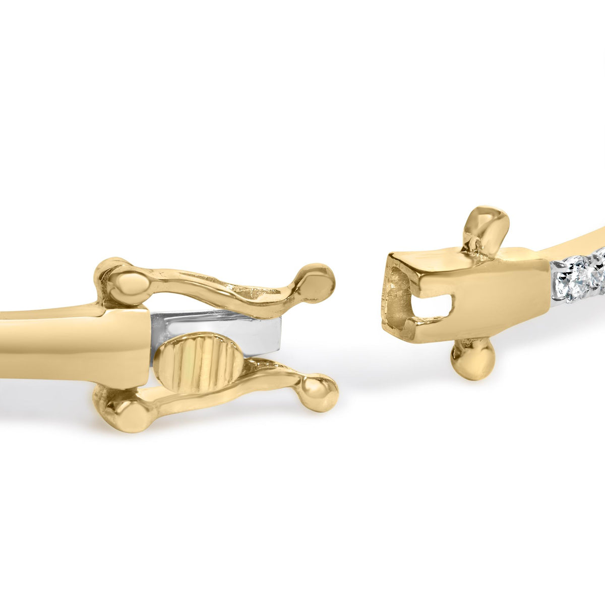 Close-up front angle of a yellow metal bracelet clasp featuring multiple prong-set white gemstones. The image focuses on the intricate design and gemstone settings of the clasp.