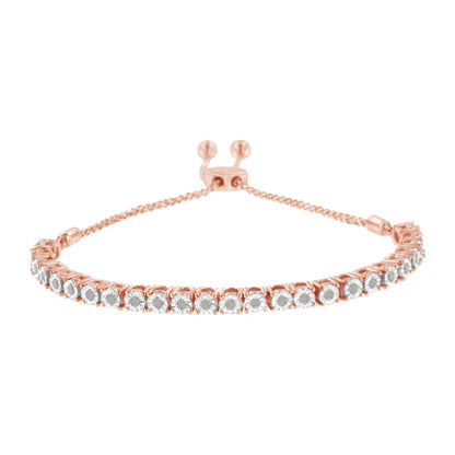 Close-up front angle of a rose metal bracelet featuring a row of round white gemstones in miracle settings with an adjustable sliding clasp.