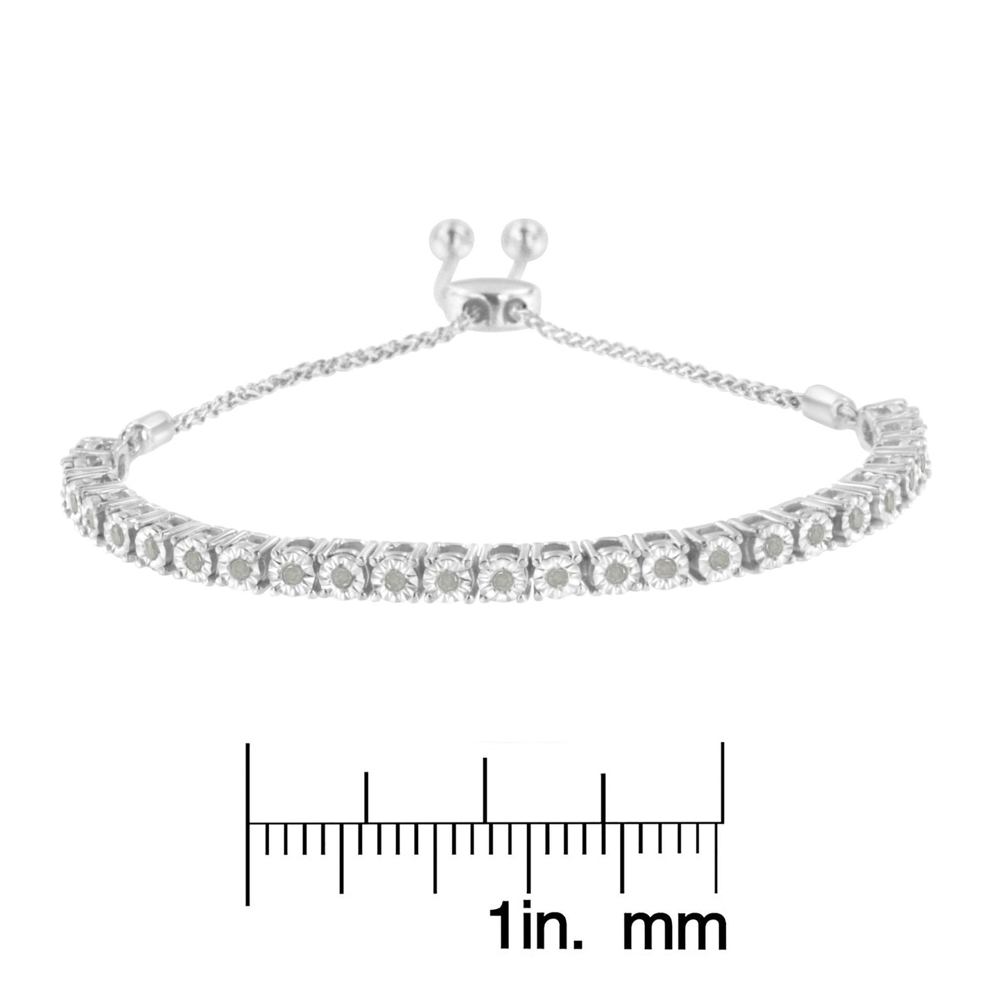 White metal bracelet with round white gemstones in miracle settings, shown from the front angle, placed above a ruler for size reference.