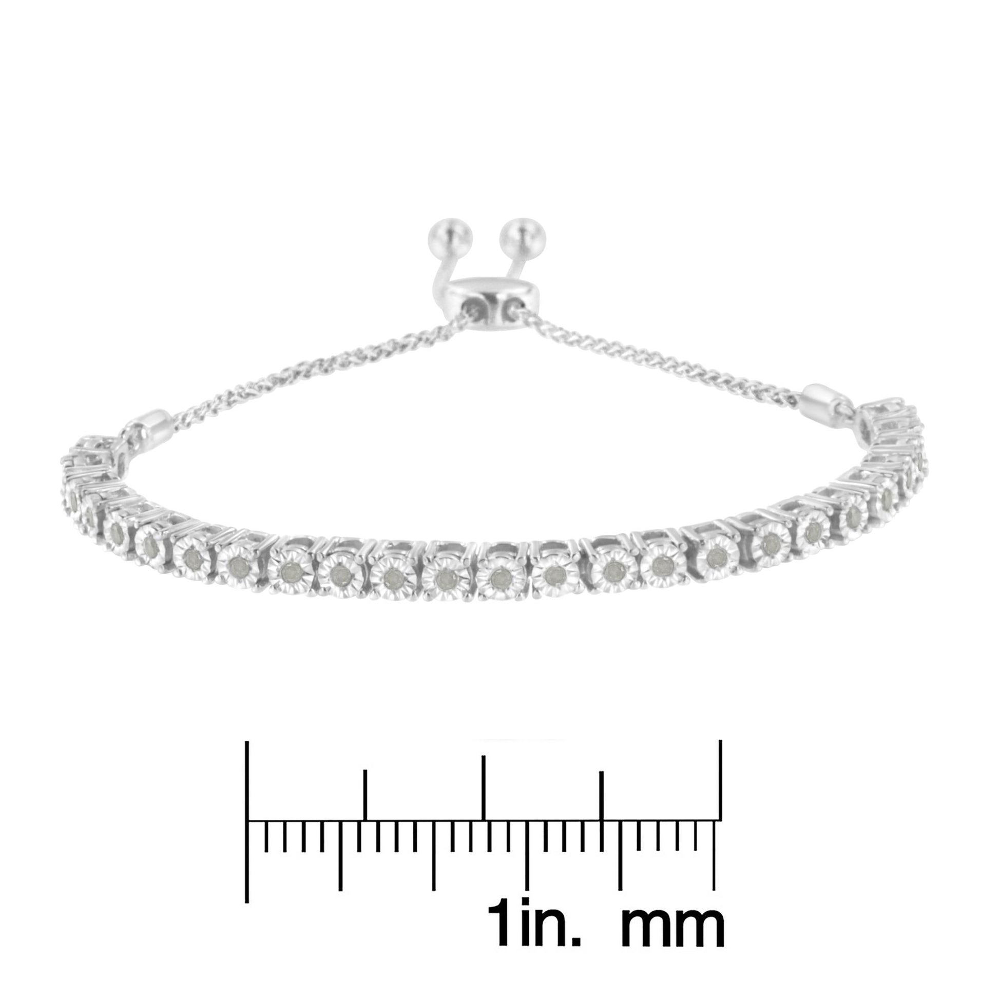 White metal bracelet with round white gemstones in miracle settings, shown from the front angle, placed above a ruler for size reference.