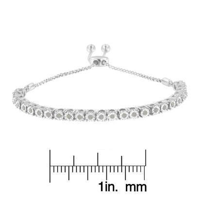 White metal bracelet with round white gemstones in miracle settings, shown from the front angle, placed above a ruler for size reference.