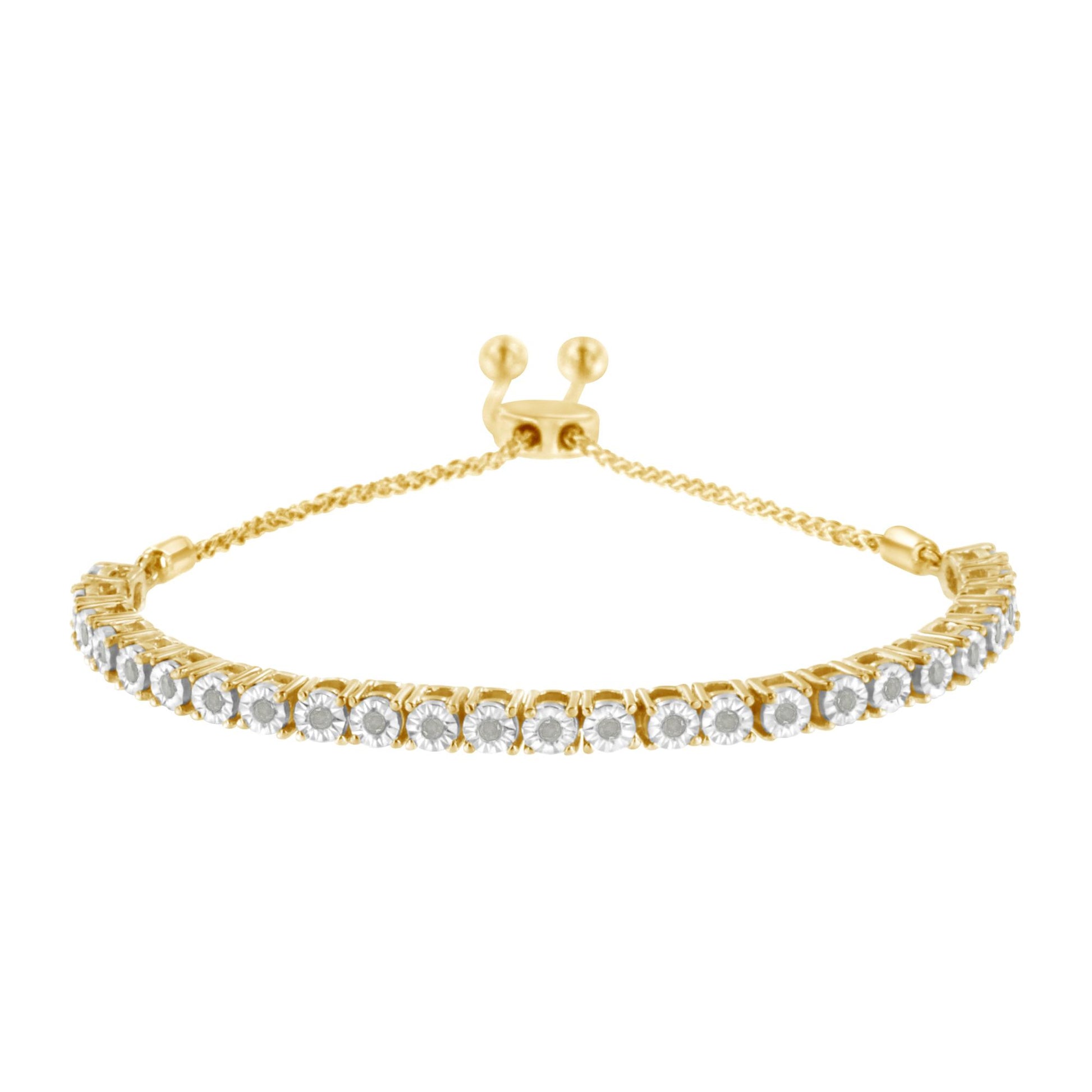 Yellow metal bracelet with a row of white round gemstones in miracle settings, photographed from the front at a slight downward angle.