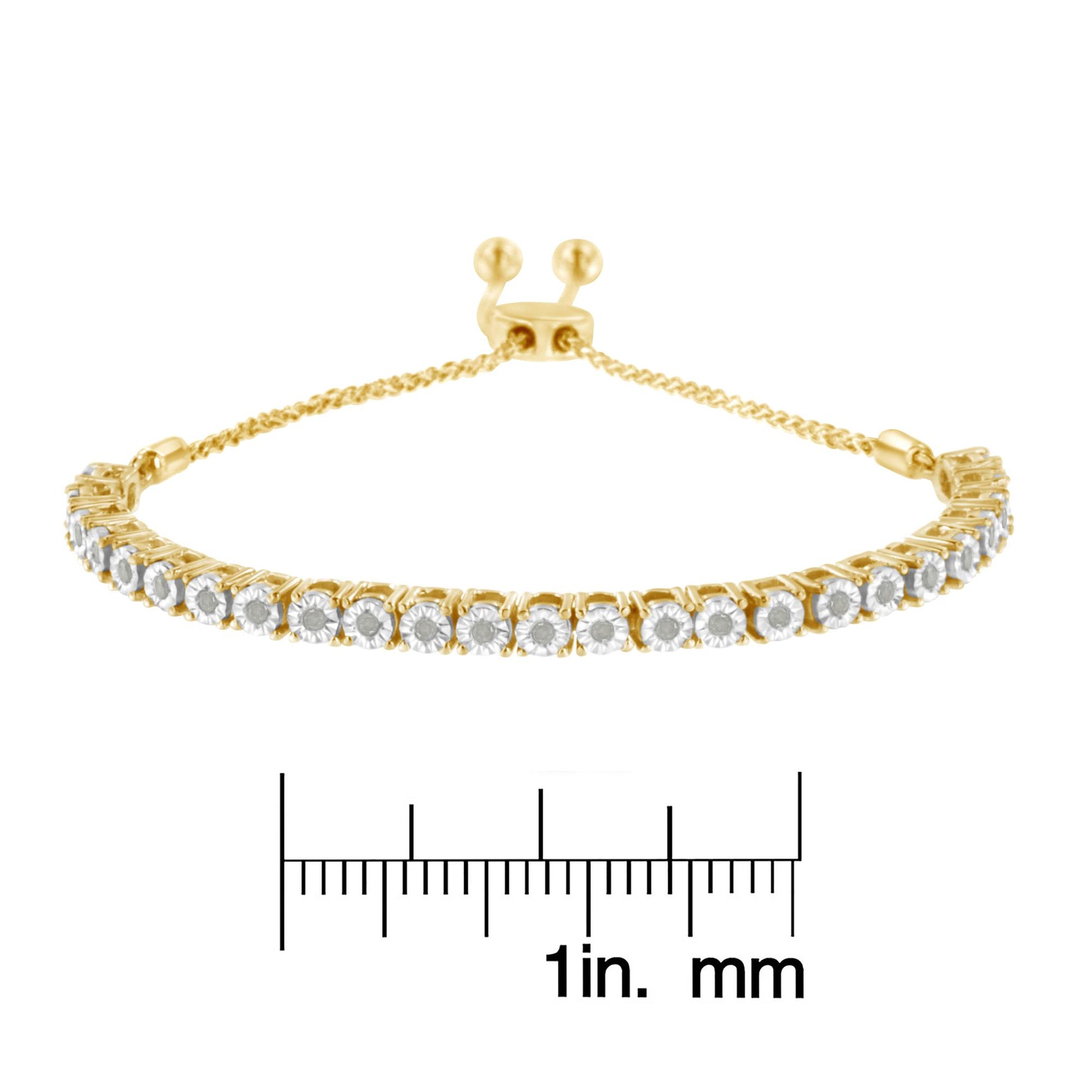 Yellow bracelet with a row of round white gemstones in miracle settings, shown from a front angle with a ruler for size reference.
