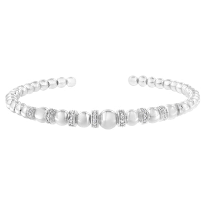 White metal bracelet featuring round pave-set white gemstones between polished beads, shown from a front angle.