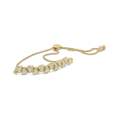 Yellow bracelet with a row of heart-shaped links set with white round gemstones in pave setting, shown in a front angled close-up.