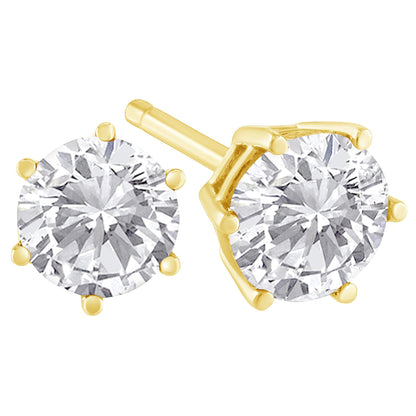 Close-up front and side angle of a pair of yellow metal stud earrings with round white gemstones in prong settings.