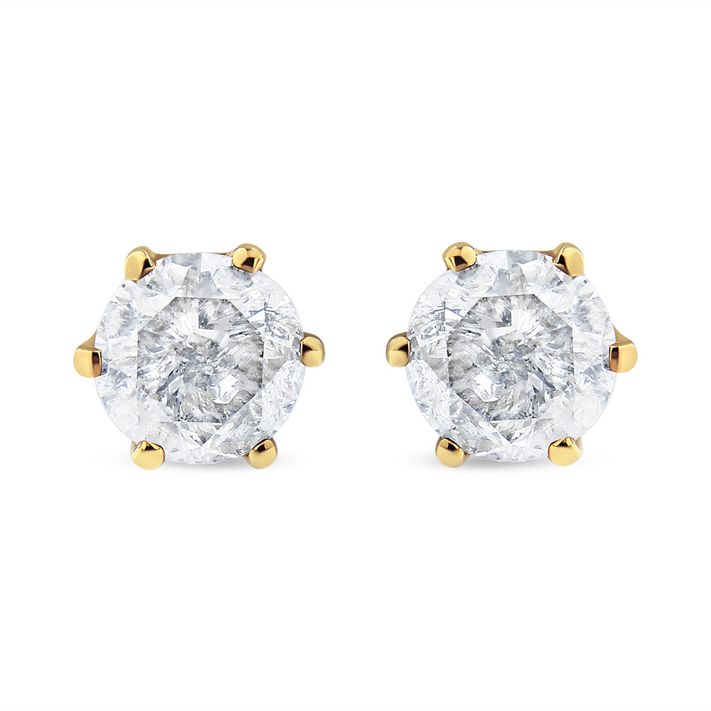 Pair of yellow metal stud earrings with round white gemstones in a six-prong setting, front-facing angle.