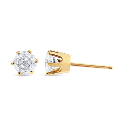 Close-up side and front view of yellow metal stud earrings with round white gemstones in prong settings.