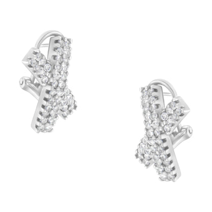 Close-up front angle of white metal X-shaped earrings adorned with multiple small round white gemstones in prong settings.