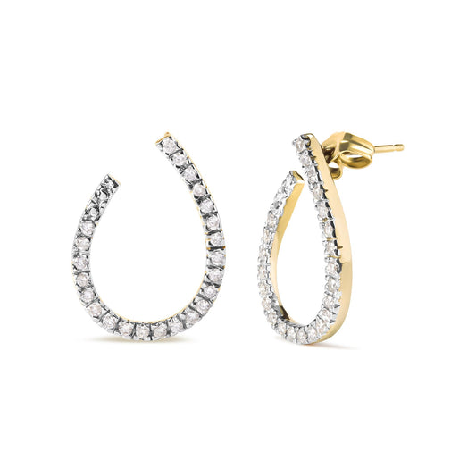 Pair of yellow metal earrings with curved open teardrop shape, encrusted with round white gemstones in prong settings, shown from front and side angles on a white background.