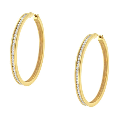 Pair of yellow hoop earrings with a row of channel-set round white gemstones, shown at a slight angle.
