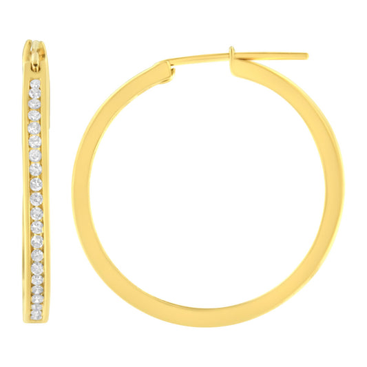Pair of yellow hoop earrings with one earring shown from the front displaying channel-set white round gemstones, and the other shown from the side, against a white background.