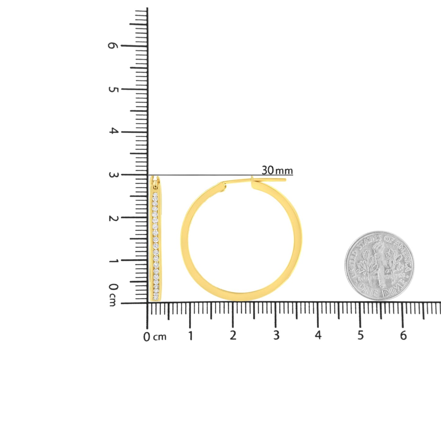 Front and side views of yellow metal hoop earrings with channel-set round white gemstones, shown on a ruler for size reference.