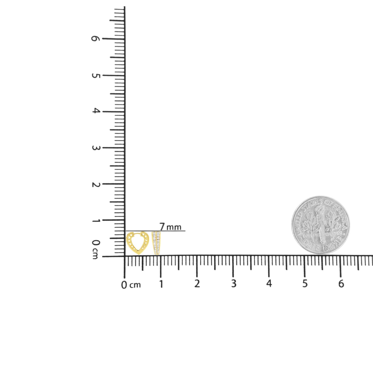 Top down view of a pair of yellow metal earrings on a ruler for size reference, one shaped like an open heart with channel set white round gemstones and the other a tapered bar with channel set white baguette gemstones.
