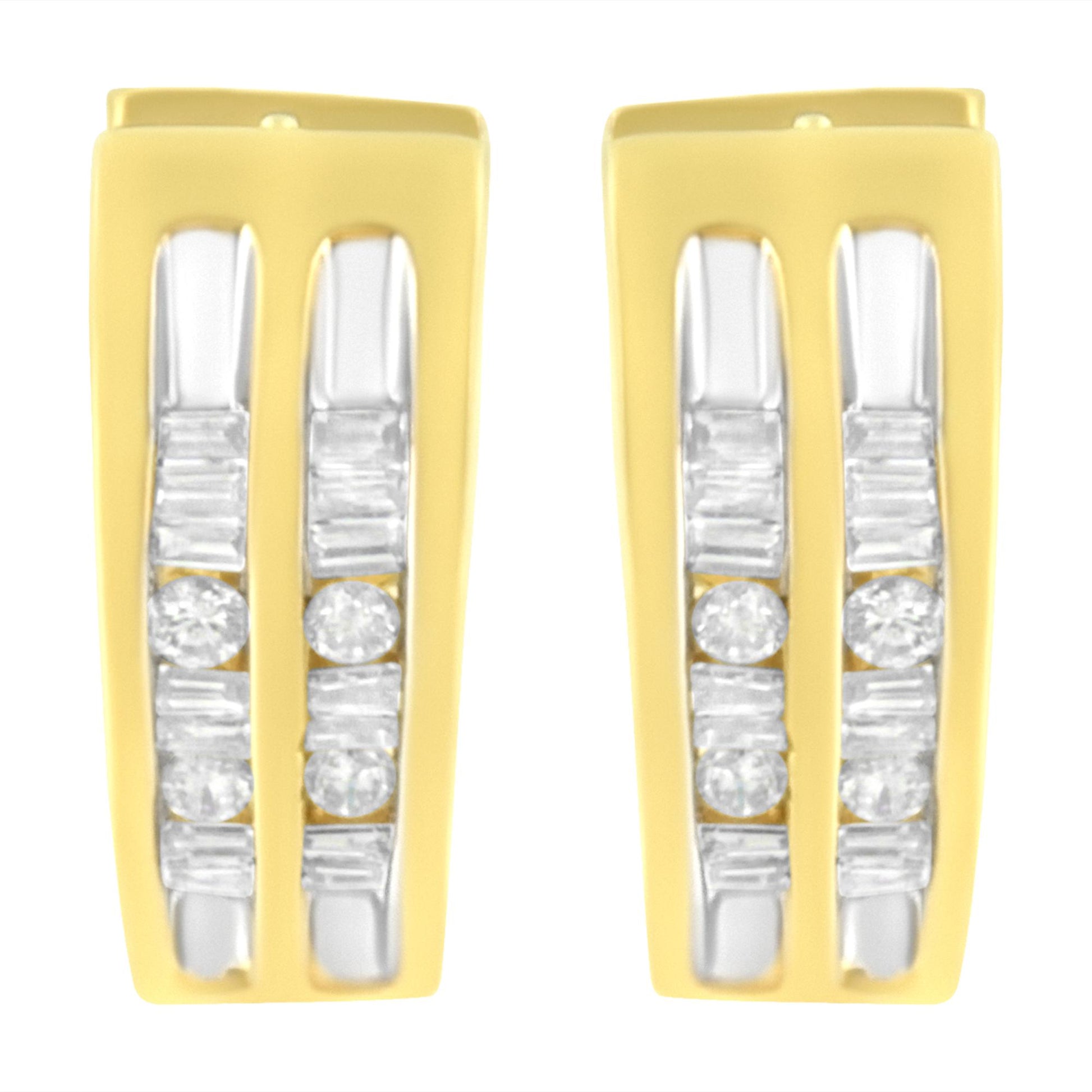 Front-facing shot of a pair of yellow metal earrings with channel-set white round and baguette-shaped gemstones arranged vertically.