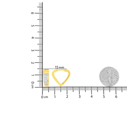 Close-up front and back view of yellow metal earrings with white princess-shaped gemstones in invisible setting, displayed on a ruler and next to a coin for size reference.