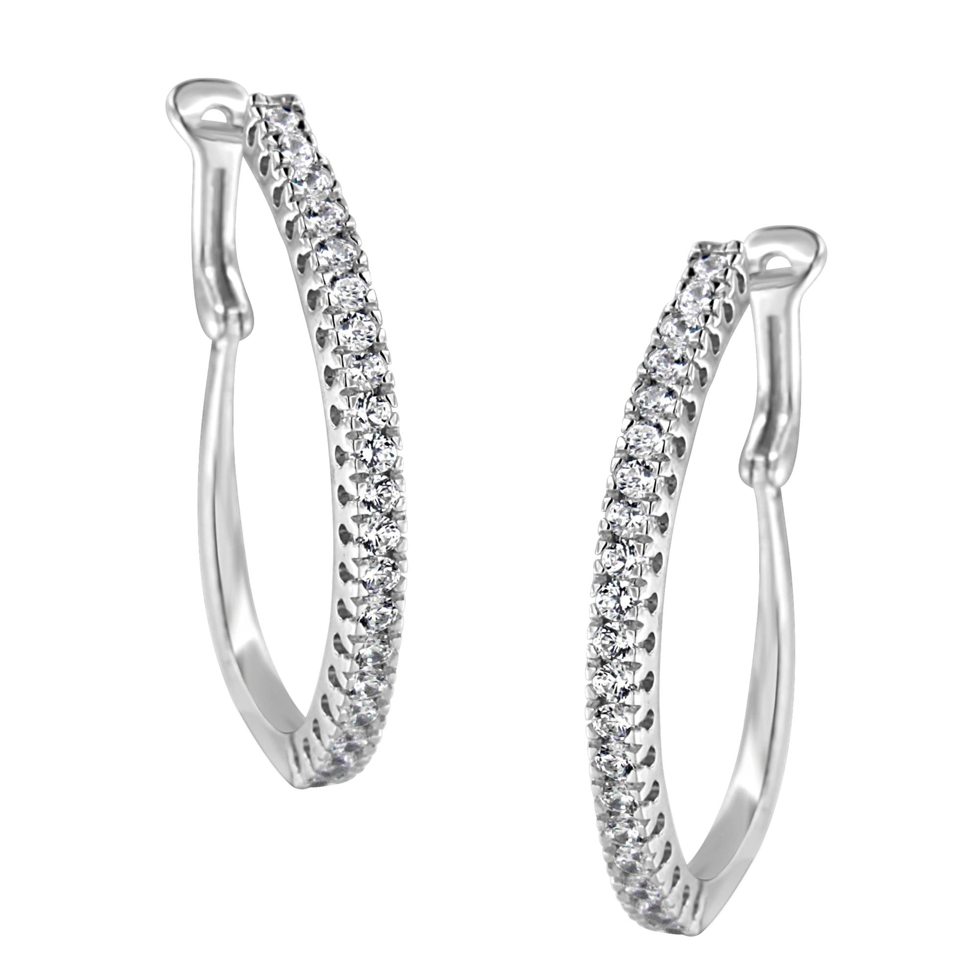 Front angled view of a pair of white metal hoop earrings featuring two rows of round white gemstones in pave setting.