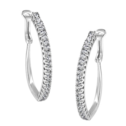 Front angled view of a pair of white metal hoop earrings featuring two rows of round white gemstones in pave setting.