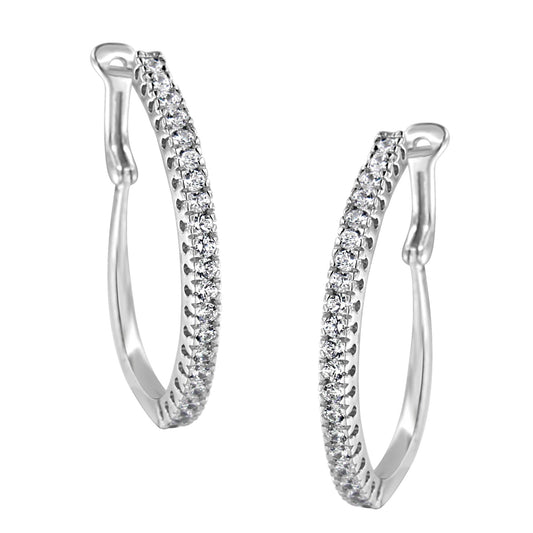 Front angled view of a pair of white metal hoop earrings featuring two rows of round white gemstones in pave setting.