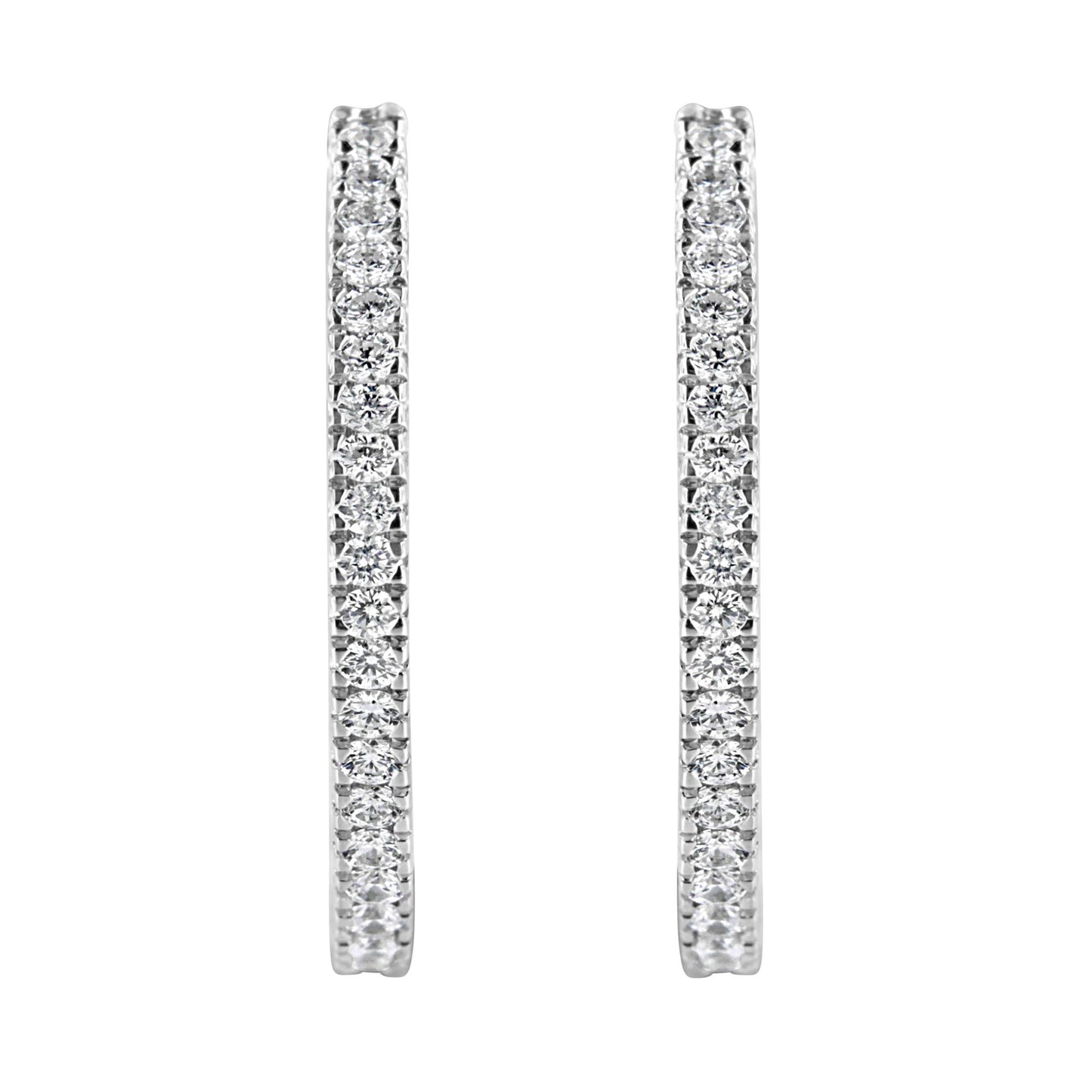 Front-facing close-up of a pair of white metal hoop earrings with round white gemstones in a pave setting.