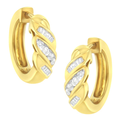 Pair of yellow metal hoop earrings with channel-set white round and baguette gemstones, front angled view.