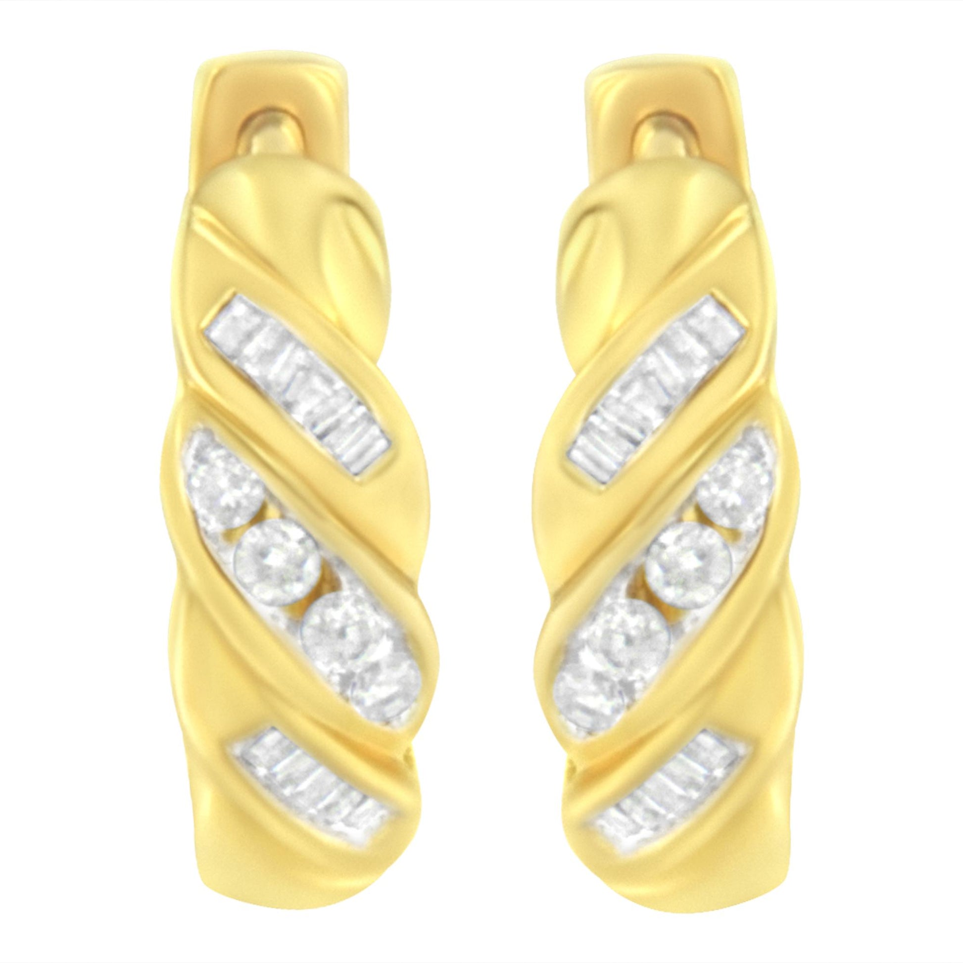 Pair of yellow metal earrings with channel-set white round and baguette-shaped gemstones, shown from a front angle.
