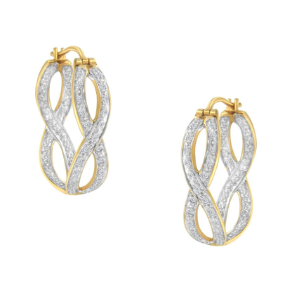 Close-up front angle view of a pair of yellow metal earrings with an intertwined design, featuring two rows of prong-set round white gemstones.